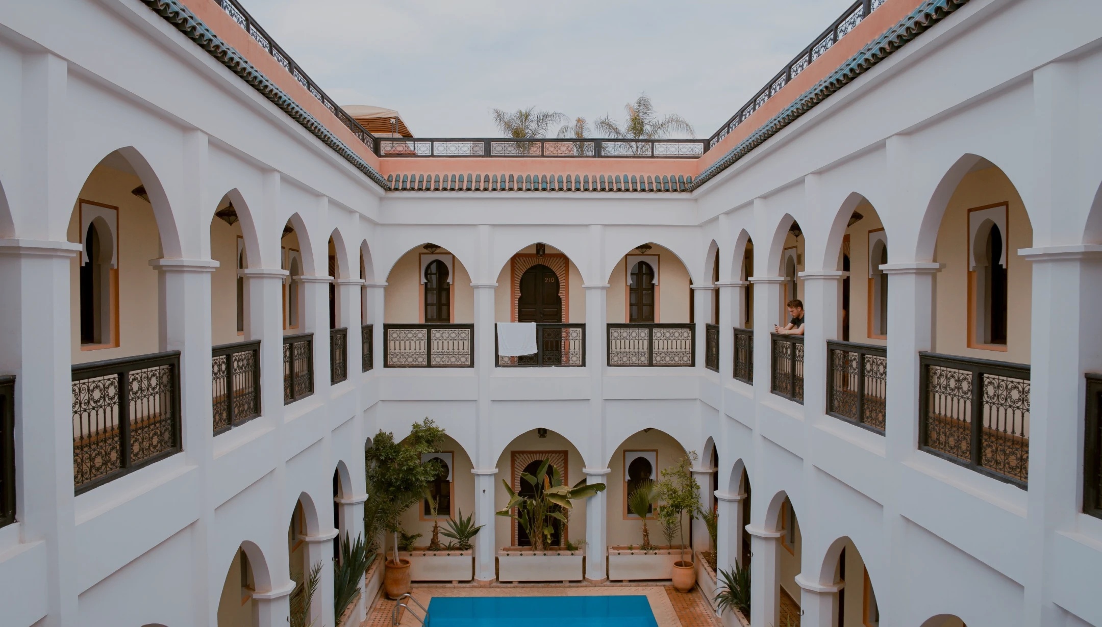 Courtyard and arched balconies at Namur Hotel